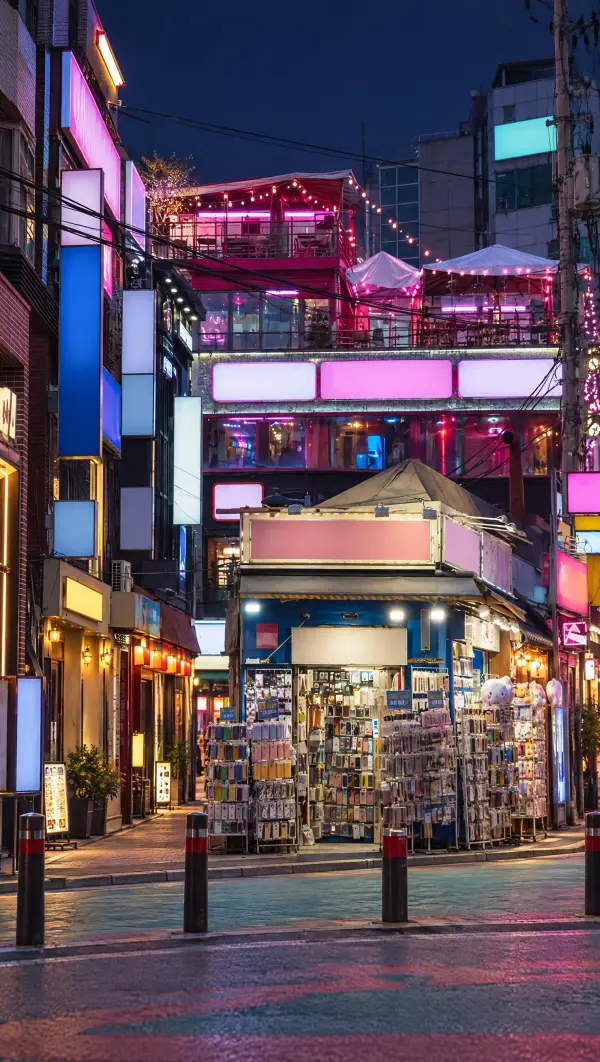 Neon signs on a Hongdae street at night